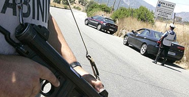 Carabinieri man a roadblock in the southern Italian town of San Luca after six people were killed in Duisberg, Germany