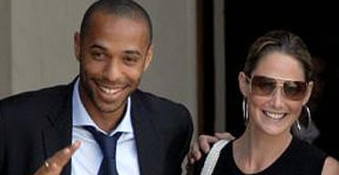 French football player Thierry Henry and his wife Nicole attend
