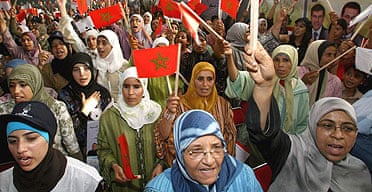 Women wave Moroccan flags as they cheer Saadeddine Othmani, the leader of the Islamist Justice and Development Party