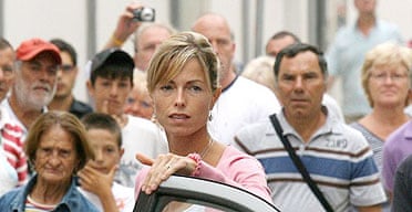 A crowd looks on as Kate McCann arrives at the police station in Portimao, southern Portugal