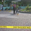 People stand near a mosque in Male in the Maldives.