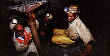 Miners work underground at the Harmony Goldmine, near Carletonville, South Africa.