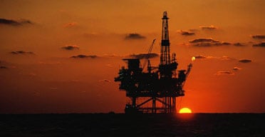 Oil platform in the Gulf of Mexico at sunset