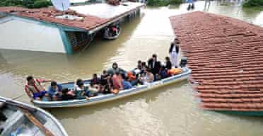 Residents of Villahermosa, the capital of the state of Tabasco, are rescued by the Mexican navy