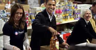 Democratic presidential hopeful, Barack Obama, fills boxes with food donated for people for the Thanksgiving holiday in Manchester, NH