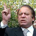 Former Pakistani prime minister Nawaz Sharif (C) gestures as he arrives to meet sacked chief justice Iftikhar Muhammad Chaudhry at his residence in Islamabad