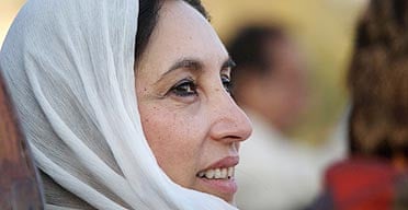 Former Pakistani Prime Minister Benazir Bhutto gazes towards a crowd of thousands of supporters at a campaign rally minutes before she was assassinated in a bomb attack December 27, 2007 in Rawalpindi, Pakistan