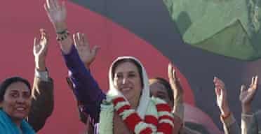 Benazir Bhutto waves to supporters.