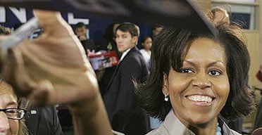 Michelle Obama signs autographs after a town hall meeting in Las Vegas.