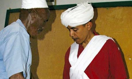 Barack Obama, right, is dressed as a Somali elder by Sheikh Mahmed Hassan, left, during his visit to Wajir in northeastern Kenya, near the borders with Somalia and Ethiopia. Photograph: AP
