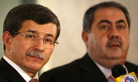 Turkish envoy Ahmet Davutoglu (l) with the Iraqi foreign minister, Hoshiyar Zebari
