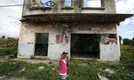 The derelict Gordons Grocery now lies right in the centre of a no man's land in between north and south Rosetown Kingston, Jamaica. Photograph: David Levene