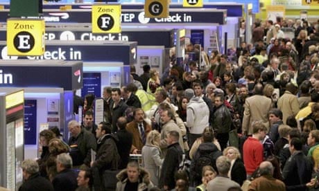 Passengers queue at Heathrow airport