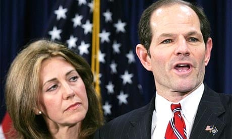 New York Governor Eliot Spitzer addresses the media with his wife Silda Wall Spitzer at his side