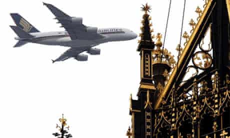 The Singapore Airlines superjumbo flies over the Palace of Westminster in London today as it approaches Heathrow airport for the first time