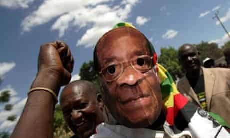  A man wears a Robert Mugabe mask in Harare