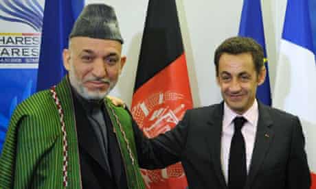 Nicolas Sarkozy with Hamid Karzai at the Nato summit in Bucharest where the French president announced he would send reinforcements to help the alliances mission in Afghanistan.