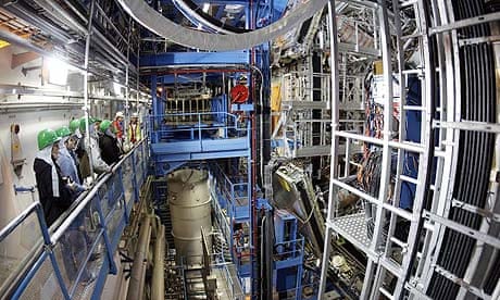 Visitors stand in front of the ATLAS detector during the LHC (Large Hadron Collider) Open Day at the European Particle Physics laboratory (CERN) in Geneva, Switzerland