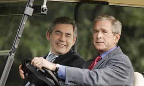 George Bush and Gordon Brown in a golf cart.