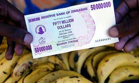 A man holds the new Zimbabwean 50 million dollar note