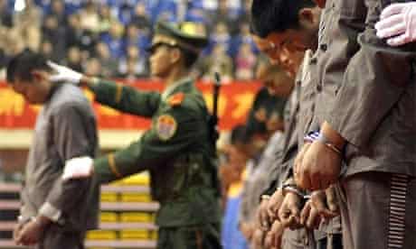 Chinese police display a group of prisoners at a sentencing rally in the east Chinese city of Wenzhou