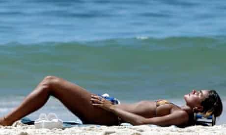 A sunbather on a beach