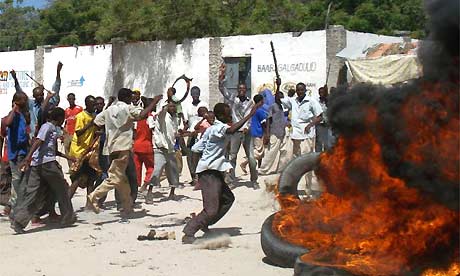 Somalis burn tyres and throw stones during a demonstration over inflation and food prices in Mogadishu
