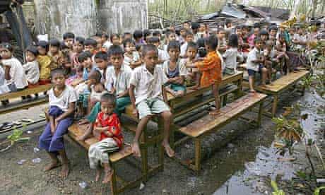 Children congregate outside a school near Kundangon, Burma
