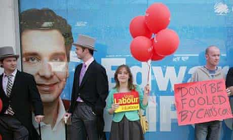 Labour supporters dressed as 'Tory Toffs' stand outside the office of Conservative candidate Edward Timpson in Crewe, Cheshire