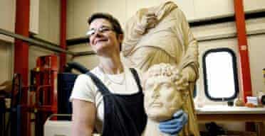 Conservator Tracey Sweekwith the head of Hadrian which the British Museum says was wrongly matched to its torso by well-meaning restorers in the 19th century