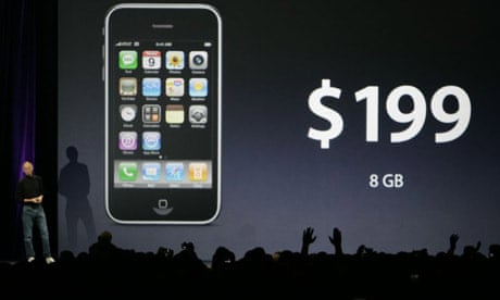 Attendees applaud as Apple CEO Steve Jobs announces that the new entry level Apple iPhone 3G will cost $199