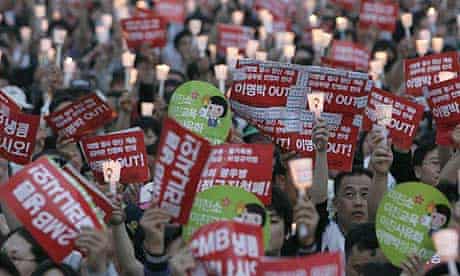 Protesters hold a candlelight vigil in Seoul over a decision to lift restrictions on US beef imports