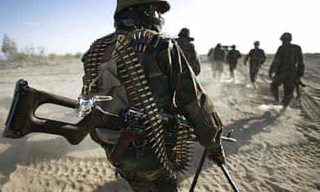 Afghan soldiers patrol a Taliban stronghold in Kandahar. Afghanistan blames Pakistan for escalating violence in the area