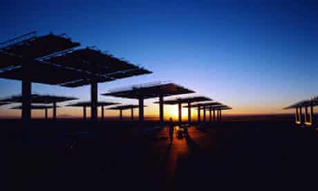 The sun sets over solar panels in New Mexico. Photograph: Corbis