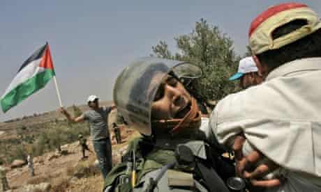 Israeli border police clash with Palestinian demonstrators in Nilin