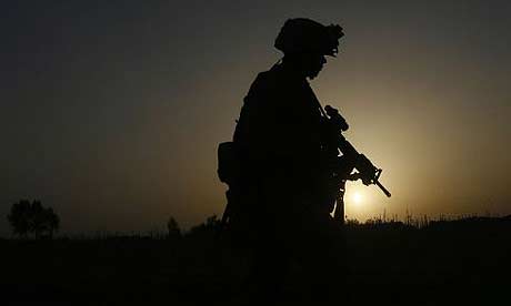 A US marine with the 24th Marine Expeditionary Unit patrols in the town of Garmser, in Helmand province, Afghanistan