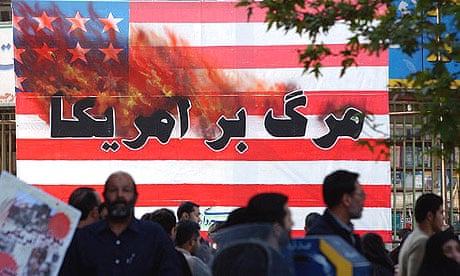 Iranians pass a US flag with a sign reading "Death to America" as they attend a rally in Tehran, in 2004.