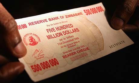 A shopper holds a Z$500m bank note in Zimbabwe