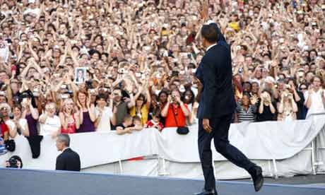 Barack Obama waves to the crowd in Berlin. Photograph: Carsten Koall/Getty Images