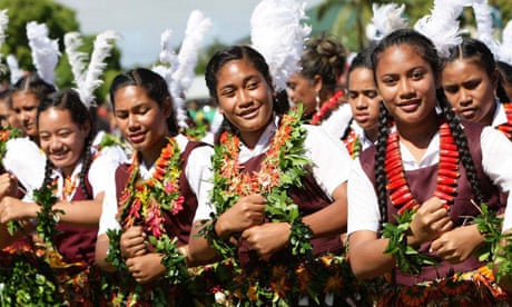 Tongan students wearing seed necklaces perform a dance for King George Tupou V during celebrations in the capital, Nuku'alofa. The monarch will be formally installed as the 23rd ruler of the South Pacific's only absolute aristocracy at a coronation ceremony on August 1