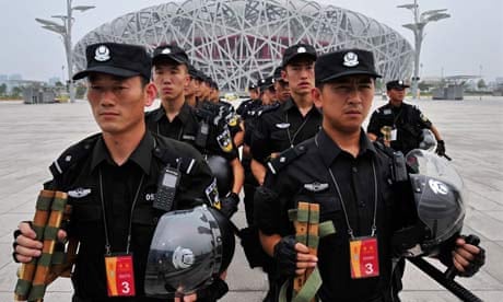 Chinese SWAT team march in front of the National Stadium