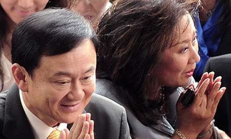 Thaksin Shinawatra and his wife, Pojaman, in Bangkok last month