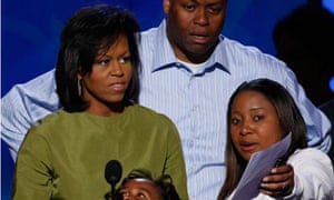 Michelle Obama onstage before the opening of the Democratic party convention with her brother Craig Robinson and her daughter Sasha