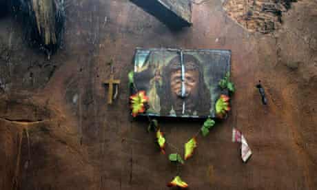 A defaced portrait of Jesus hangs on the wall of a Christian house after mob violence in Orissa, India