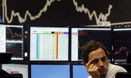  A trader reacts in front of the DAX board at the Frankfurt stock exchange