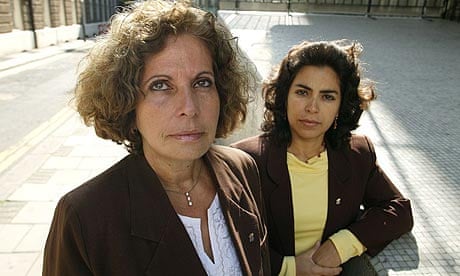 Olga Salanueva Arango (L) and Adriana Perez O'Connor, wives of two Cuban nationals arrested and jailed on charges of intent to commit espionage and threatening US national security