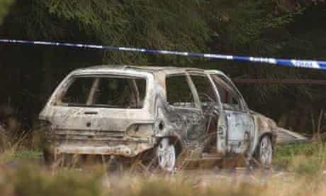 A burned car believed to have been used in the Northern Bank robbery