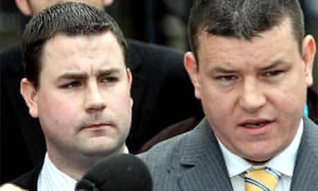 Chris Ward, left, and his solicitor Niall Murphy speak to reporters outside Belfast crown court after Ward was cleared of involvement in the 2004 robbery of Northern Bank