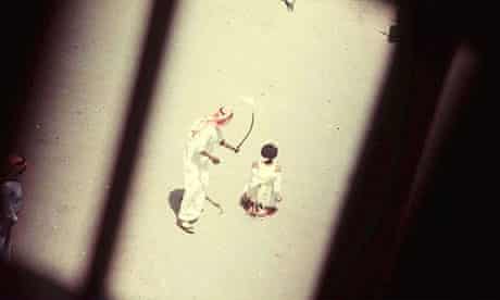 A Saudi executioner prepares to behead a convicted drug dealer in Jeddah in this 1985 image
