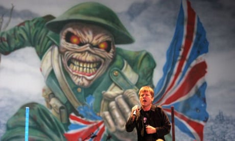Iron Maiden singer Bruce Dickinson performs beneath an Eddie the Head flag 